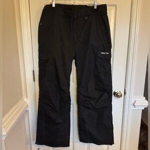 Arctix Men's Snow Pants in Black. Insulated around boots. Small tear on hip.
